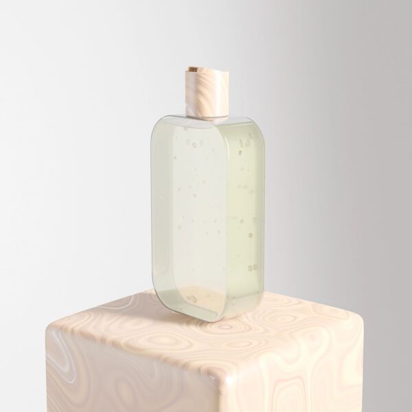 Pure vanilla extract bottle styled on a clean white background in warm earth tones